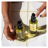 Hands with OMOrganics PinkCoconut AromaticBodyOil 